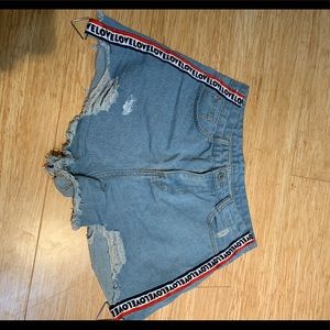 blue denim shorts with “Love” stripes